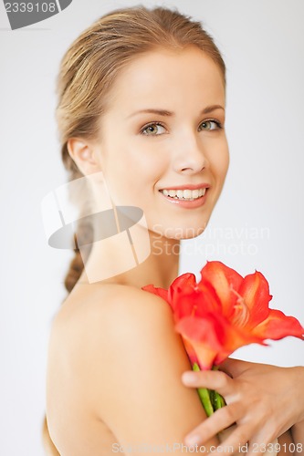 Image of lovely woman with lily flower