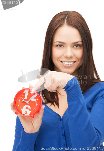 Image of woman holding alarm clock