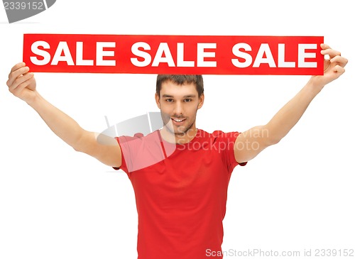 Image of handsome man with sale sign