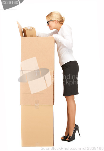 Image of businesswoman with big boxes