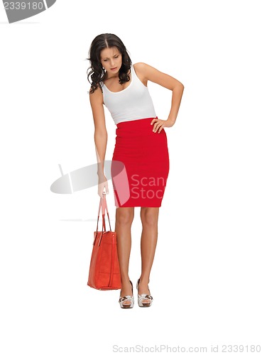 Image of unhappy woman with heavy bag
