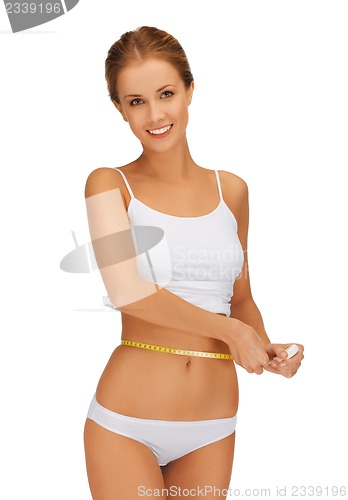 Image of woman measuring her waist