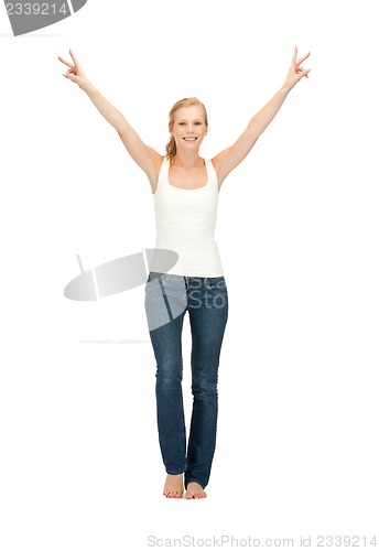 Image of girl in blank white t-shirt showing victory sign