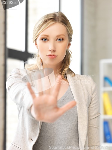 Image of young woman making stop gesture