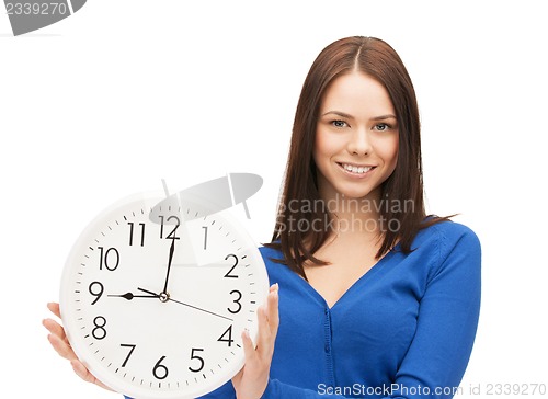Image of woman holding big clock