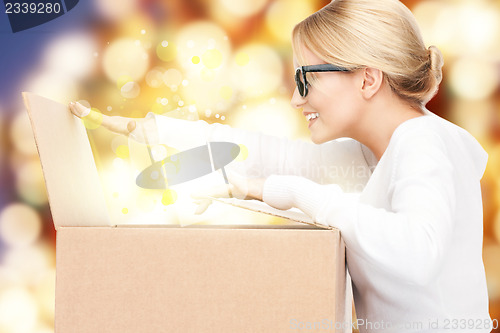 Image of attractive businesswoman with cardboard box