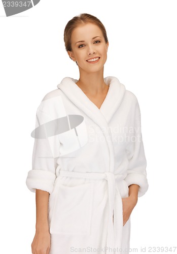 Image of beautiful woman in white bathrobe