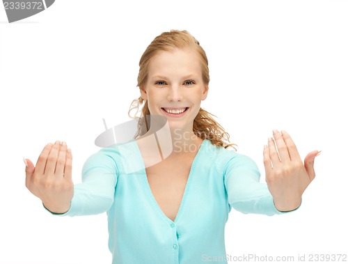 Image of teenage girl making inviting gesture