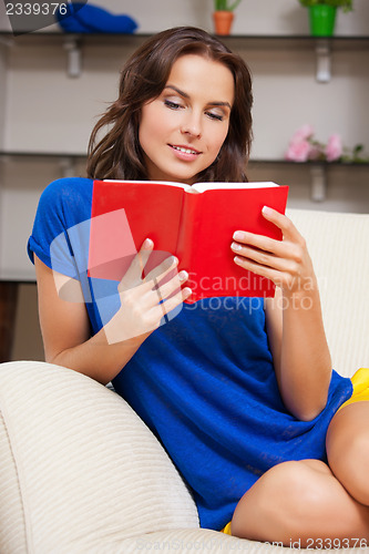 Image of happy and smiling woman with book