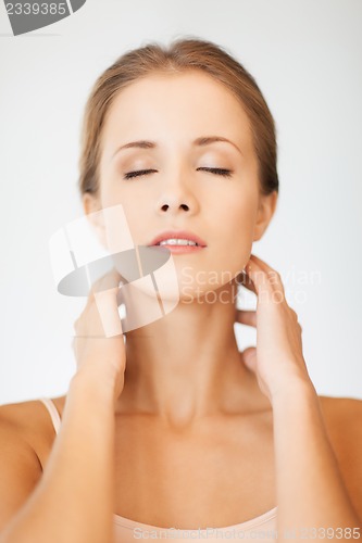 Image of face and hands of beautiful woman