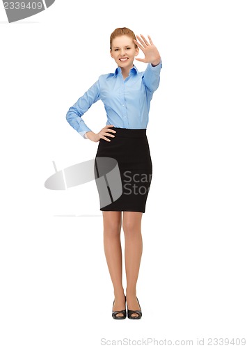 Image of stewardess making greeting gesture