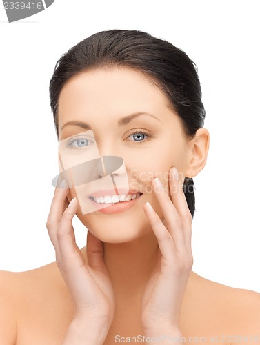 Image of face and hands of beautiful woman