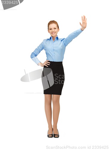 Image of stewardess making greeting gesture