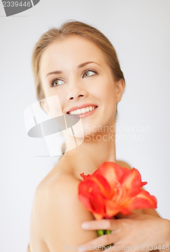 Image of lovely woman with lily flower