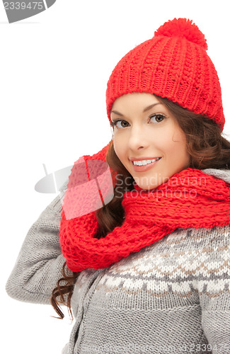 Image of beautiful woman in hat, muffler and mittens