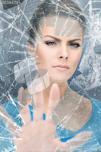 Image of woman breaking glass