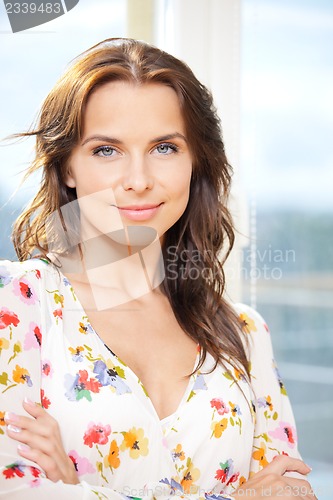 Image of happy woman at the window