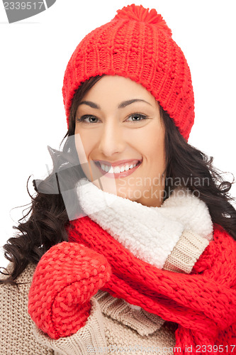 Image of beautiful woman in hat, muffler and mittens