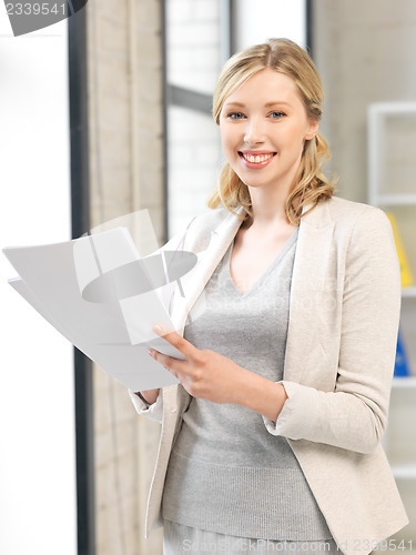 Image of happy woman with documents