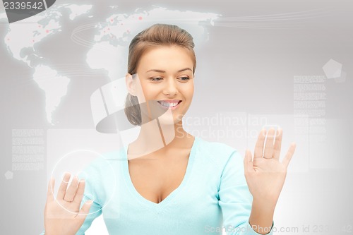 Image of businesswoman working with touch screen