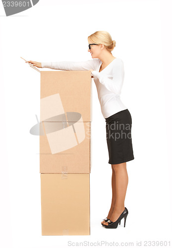 Image of businesswoman with big boxes