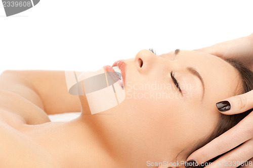 Image of beautiful woman in massage salon