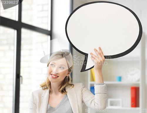 Image of smiling businesswoman with blank text bubble
