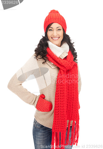 Image of beautiful woman in hat, muffler and mittens