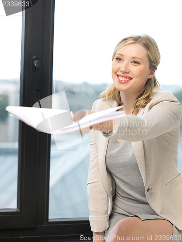 Image of happy woman with documents