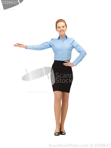 Image of smiling stewardess showing direction