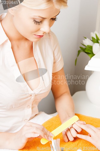 Image of woman having a manicure at the salon