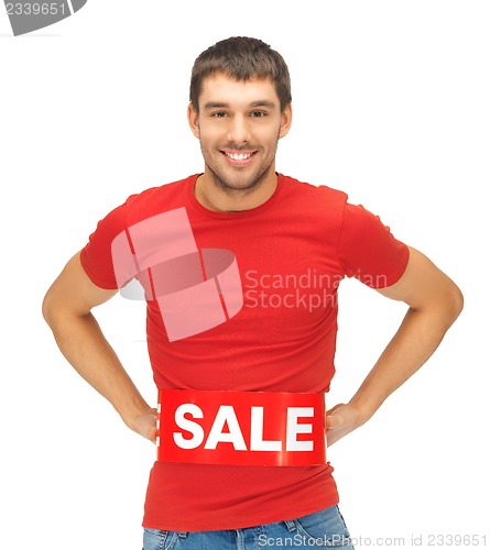 Image of handsome man with sale sign