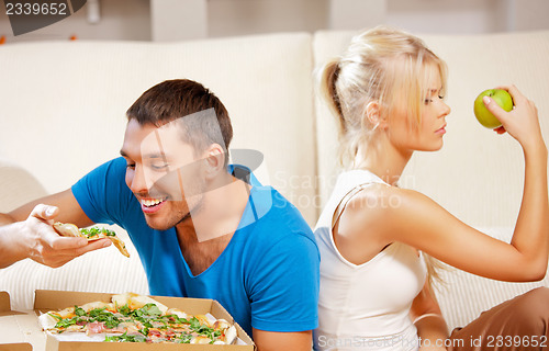 Image of couple eating different food