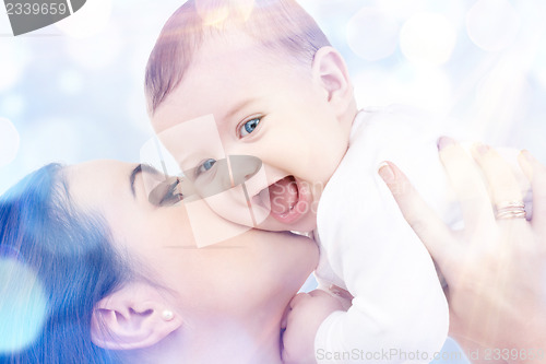 Image of happy mother with baby in hands