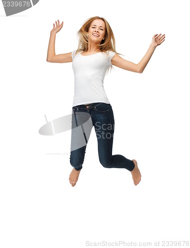 Image of jumping teenage girl in blank white t-shirt