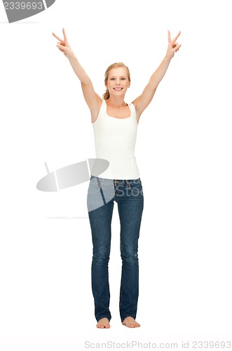 Image of girl in blank white t-shirt showing victory sign