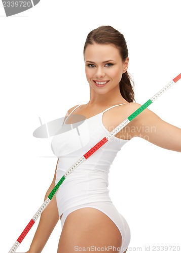 Image of young beautiful woman with measure tape