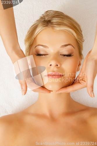 Image of beautiful woman in massage salon