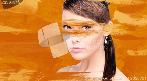 Image of woman with orange paint