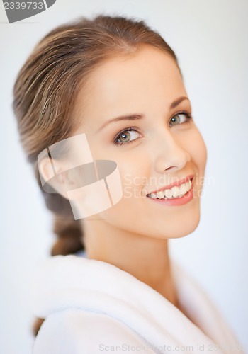 Image of beautiful woman in bathrobe