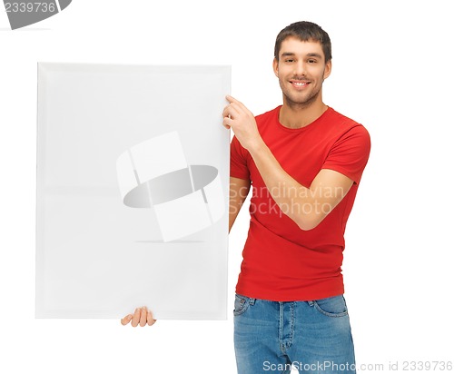 Image of handsome man with big blank board