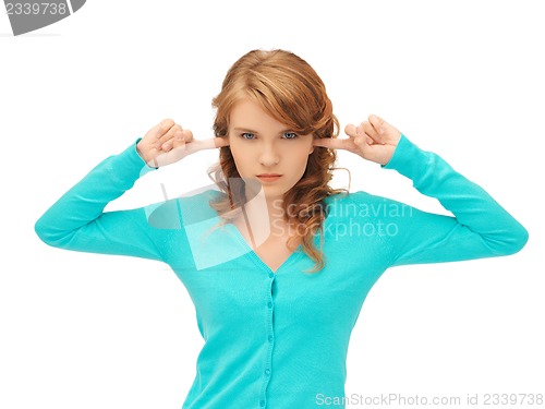 Image of student with fingers in ears