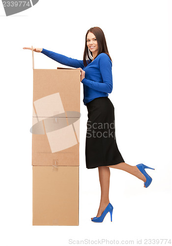 Image of businesswoman with big boxes