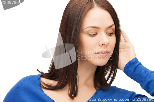 Image of serious woman listening gossip