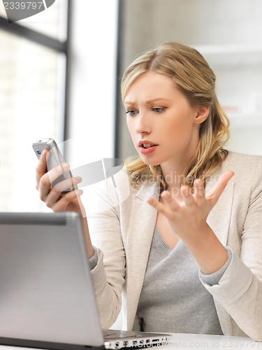 Image of businesswoman with cell phone