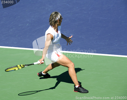 Image of Woman playing tennis