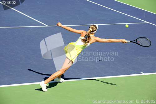 Image of Woman playing tennis