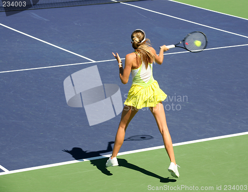 Image of Woman playing tennis