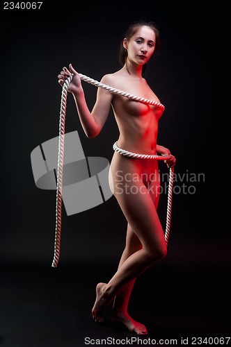 Image of attractive naked woman with rope