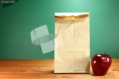 Image of School Lunch Sack Sitting on Teacher Desk